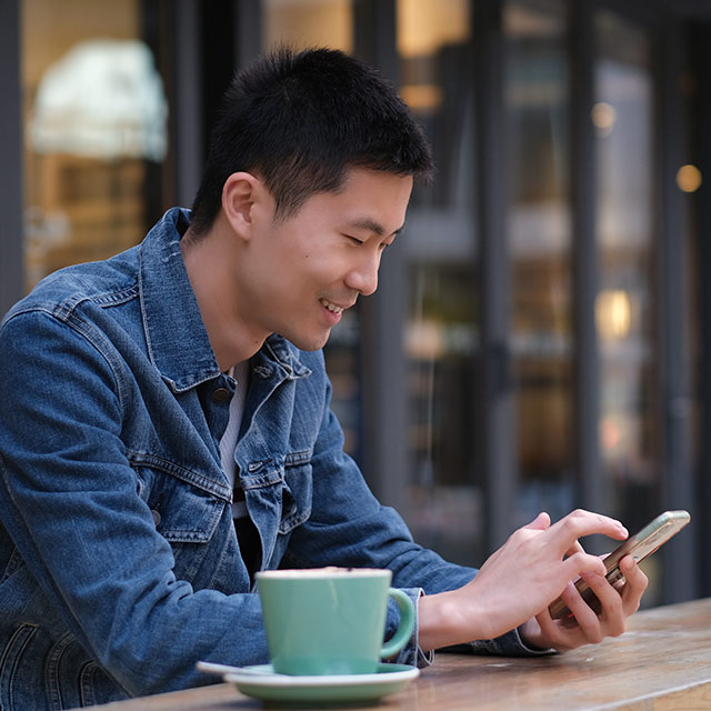 man with coffee and computer